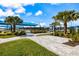 Enjoy community amenities including shaded seating and manicured landscaping, perfect for relaxation and social gatherings at 10240 Beach Dune Dr, Englewood, FL 34223
