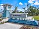 Welcoming entrance to the Beachwalk community, featuring a modern water feature and manicured landscaping at 10240 Beach Dune Dr, Englewood, FL 34223
