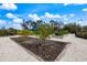 Beautiful community garden with raised garden beds and crushed shell pathways, perfect for growing your own fresh vegetables at 10240 Beach Dune Dr, Englewood, FL 34223