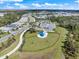 Aerial view of a community park with a covered picnic area, walking path, and green space, perfect for recreation at 10240 Beach Dune Dr, Englewood, FL 34223