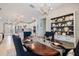 Dining room displays a wood table, decorative accents, open to a bright kitchen area at 10240 Beach Dune Dr, Englewood, FL 34223