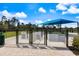 A dog park with separate areas for large and small dogs, providing a safe and fun space for pets to play at 10240 Beach Dune Dr, Englewood, FL 34223