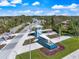 Inviting entrance to Beachwalk features a quaint water feature and picturesque landscaping at 10240 Beach Dune Dr, Englewood, FL 34223