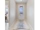 Bright entryway featuring tile floors, an decorative front door, and neutral wall paint at 10240 Beach Dune Dr, Englewood, FL 34223