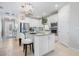 Open-concept kitchen with a breakfast bar, modern appliances, and stylish decor at 10240 Beach Dune Dr, Englewood, FL 34223
