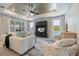 Elegant living room with plush seating, sophisticated decor, and a view of the outdoor landscape at 10240 Beach Dune Dr, Englewood, FL 34223