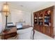 Office area with a desk, chair, bookcase, and decorative lamp at 10240 Beach Dune Dr, Englewood, FL 34223