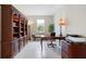 Bright office space featuring a desk, printer, shelving, and natural light from window at 10240 Beach Dune Dr, Englewood, FL 34223