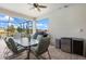 Relaxing screened-in patio with a dining table and built-in grill, perfect for entertaining at 10240 Beach Dune Dr, Englewood, FL 34223