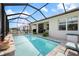 Stunning screened-in pool and patio area, perfect for outdoor entertaining at 10240 Beach Dune Dr, Englewood, FL 34223