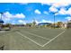 Well-maintained tennis court with professional surfacing, perfect for enjoying a game in a beautiful community setting at 10240 Beach Dune Dr, Englewood, FL 34223