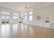 Bright yoga studio with expansive windows and ample space for group fitness activities at 10240 Beach Dune Dr, Englewood, FL 34223
