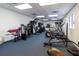 Community gym featuring various workout machines and a mirrored wall for exercise and training at 10315 Cortez W Rd # 32Bv, Bradenton, FL 34210