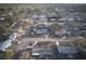 An aerial view depicts a tranquil neighborhood featuring this single-story home with beautiful trees and landscaping at 106 65Th Avenue W Dr, Bradenton, FL 34207