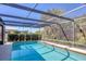 Sparkling swimming pool enclosed by a screened lanai, providing a private and relaxing outdoor experience at 109 W Matisse Cir, Nokomis, FL 34275