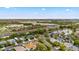 Aerial shot of homes near ponds and highways, featuring a landscape that blends residential and commercial spaces at 12710 Rockrose Gln, Lakewood Ranch, FL 34202