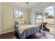 Cozy bedroom with direct access to a screened-in pool area at 12710 Rockrose Gln, Lakewood Ranch, FL 34202