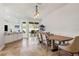 Open-concept dining area with modern lighting, spacious layout, and seamless connection to the kitchen at 12710 Rockrose Gln, Lakewood Ranch, FL 34202