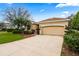 Well-maintained house with lush lawn and a two-car garage in a quiet neighborhood at 12710 Rockrose Gln, Lakewood Ranch, FL 34202