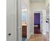 Hallway view including a bathroom vanity with granite counters at 12710 Rockrose Gln, Lakewood Ranch, FL 34202