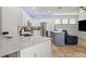 Modern kitchen featuring white cabinets, stainless appliances, and a spacious island at 12710 Rockrose Gln, Lakewood Ranch, FL 34202