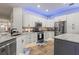 Bright kitchen featuring stainless appliances, white cabinets, tile backsplash and marble countertops at 12710 Rockrose Gln, Lakewood Ranch, FL 34202