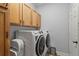 Functional laundry room with front load washer/dryer at 12710 Rockrose Gln, Lakewood Ranch, FL 34202