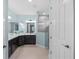 Bright bathroom with dual sinks, quartz countertop, framed mirror, and glass-enclosed shower at 12726 Rainwashed Loop, Parrish, FL 34219