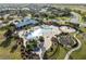 Aerial view of the community pool with splash pad, outdoor seating, and landscaping at 12726 Rainwashed Loop, Parrish, FL 34219