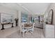 Well-lit dining area with elegant furniture, a ceiling fan, and open access to the living room at 12726 Rainwashed Loop, Parrish, FL 34219