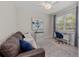 Comfortable home office setup with desk, chair, couch, and area rug at 12726 Rainwashed Loop, Parrish, FL 34219