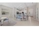 Contemporary kitchen features a breakfast bar, white cabinetry, stainless steel appliances, and a bright atmosphere at 12726 Rainwashed Loop, Parrish, FL 34219