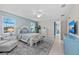 Main bedroom featuring a comfortable bed, and large windows, creating a tranquil retreat at 12726 Rainwashed Loop, Parrish, FL 34219