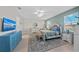 Spacious main bedroom featuring a plush bed, ample natural light, and stylish decor at 12726 Rainwashed Loop, Parrish, FL 34219