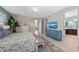 Well-lit main bedroom with a ceiling fan and views of the en-suite bathroom at 12726 Rainwashed Loop, Parrish, FL 34219