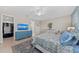 Bright main bedroom with a walk-in closet, ceiling fan and neutral decor at 12726 Rainwashed Loop, Parrish, FL 34219
