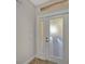 Clean, bright foyer features natural light and a stylish door with frosted panels at 130 Bella Vista Ter # 10A, Nokomis, FL 34275