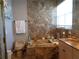 Bathroom features a large tub with decorative candles and marble surround and countertop at 1354 Tearose Pl, Sarasota, FL 34239
