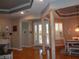 Elegant living room with hardwood floors, columns, and recessed lighting at 1354 Tearose Pl, Sarasota, FL 34239