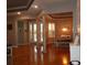 Open living room area with columns leading to dining area with hardwood floors and neutral paint at 1354 Tearose Pl, Sarasota, FL 34239