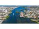 Panoramic aerial view capturing a waterfront home with a pool and dock, nestled in a vibrant coastal community at 1444 Ridgewood Ln, Sarasota, FL 34231