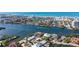 Stunning aerial view of luxury waterfront properties with boats, beaches, and cityscape views at 1444 Ridgewood Ln, Sarasota, FL 34231
