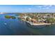 Stunning waterfront home with a pool and private dock, surrounded by lush landscaping at 1444 Ridgewood Ln, Sarasota, FL 34231