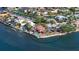 Expansive aerial view highlighting a waterfront home with a private pool and dock, set in a desirable coastal neighborhood at 1444 Ridgewood Ln, Sarasota, FL 34231