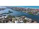 Breathtaking aerial view of a luxurious waterfront property with scenic river and ocean views at 1444 Ridgewood Ln, Sarasota, FL 34231