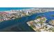 Expansive aerial view of waterfront real estate, featuring luxury homes, a private dock, and beautiful coastal scenery at 1444 Ridgewood Ln, Sarasota, FL 34231