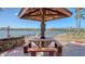 Waterfront backyard with picnic table and patio for relaxing outdoors at 1444 Ridgewood Ln, Sarasota, FL 34231