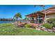 Backyard with a waterfront view, private pool, patio and lush landscaping at 1444 Ridgewood Ln, Sarasota, FL 34231