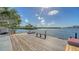Picturesque view of a waterfront dock overlooking the water and lush surroundings at 1444 Ridgewood Ln, Sarasota, FL 34231