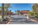 Spacious home with long driveway, palm trees, and well-maintained landscaping providing curb appeal at 1444 Ridgewood Ln, Sarasota, FL 34231